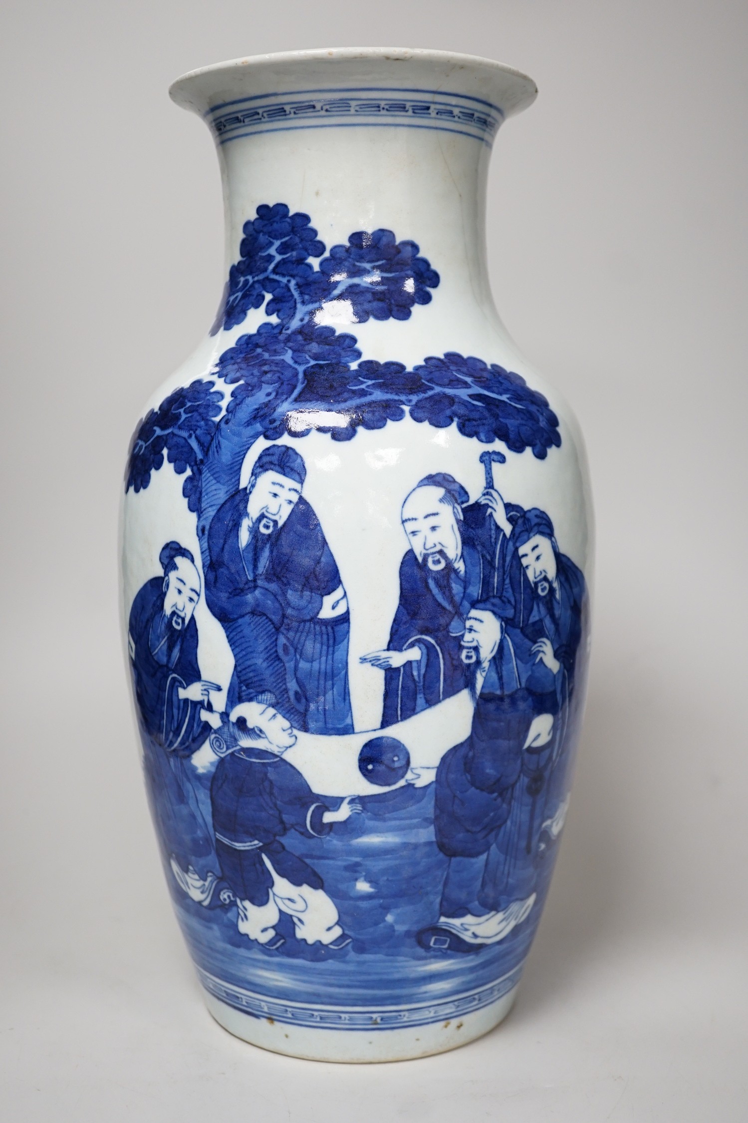 A large Chinese blue and white export vase, decorated with sages and attendants reviewing a scroll (a.f.), 37cms high